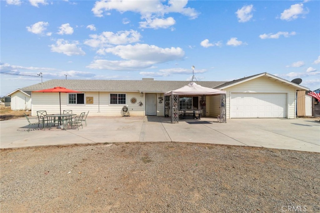 a front view of a house with a yard and a garage