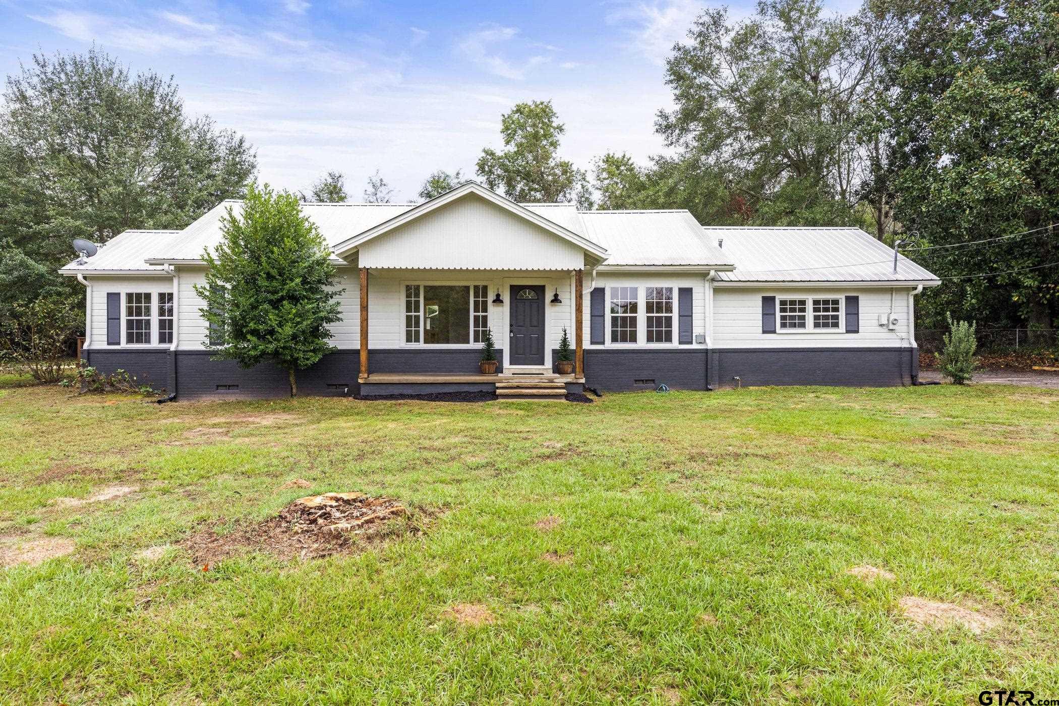 front view of a house with a yard