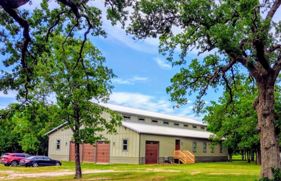 a front view of a building with garden