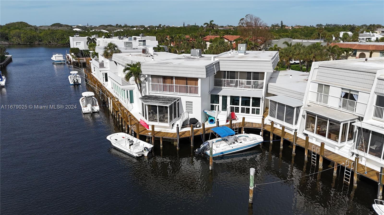 an aerial view of a house with outdoor space