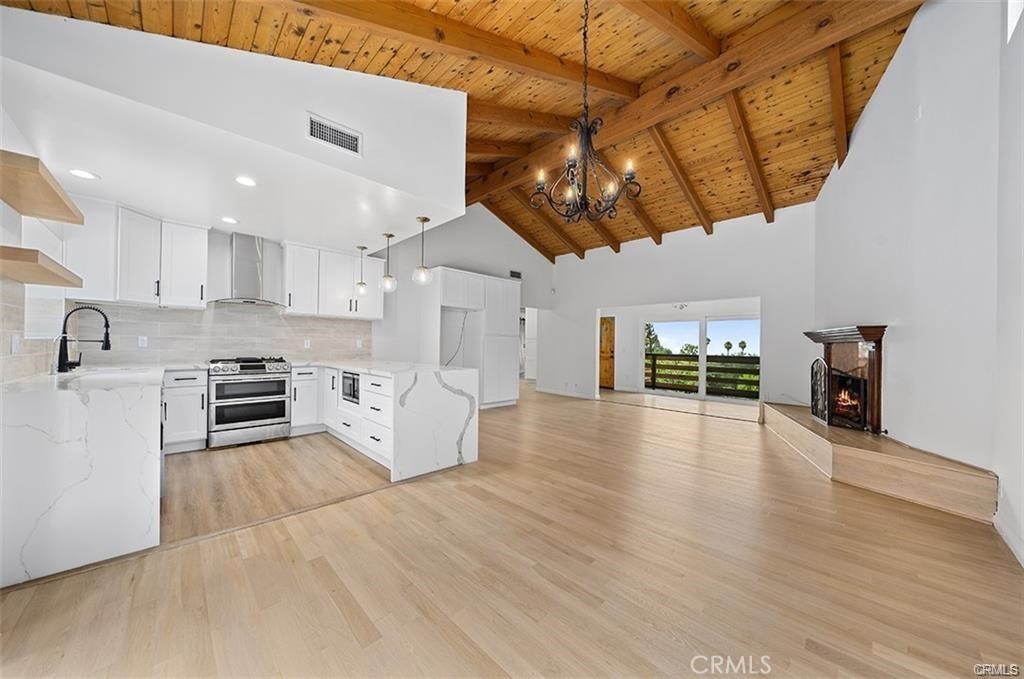 a view of a kitchen with microwave and stove