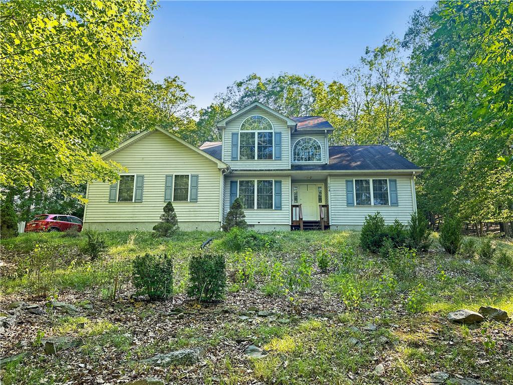 a front view of a house with a yard