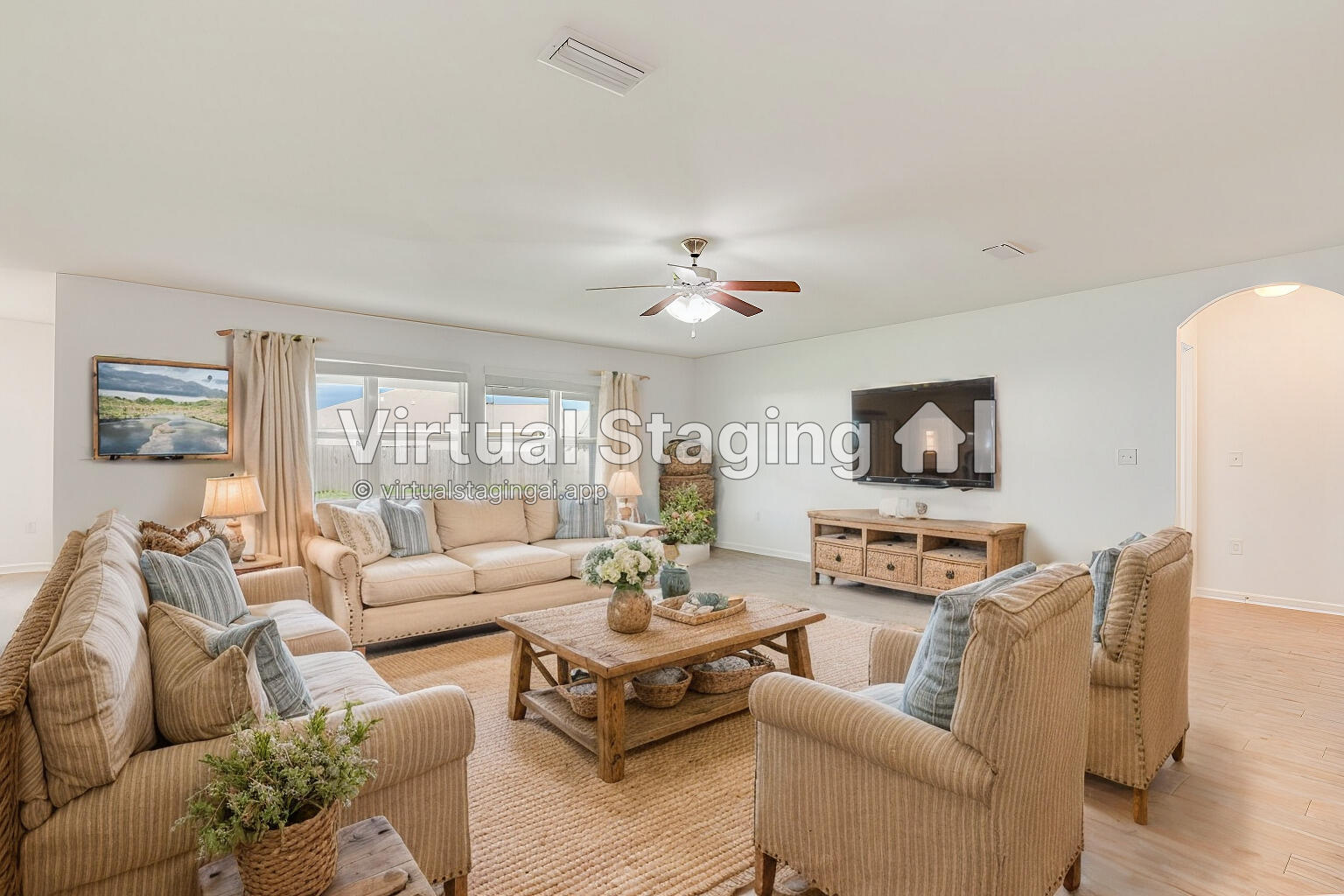 a living room with furniture and a large window