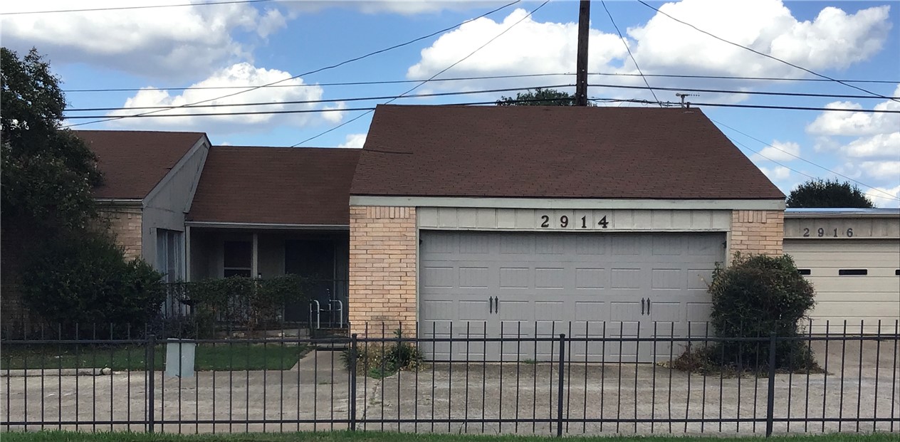 a front view of a house with garage