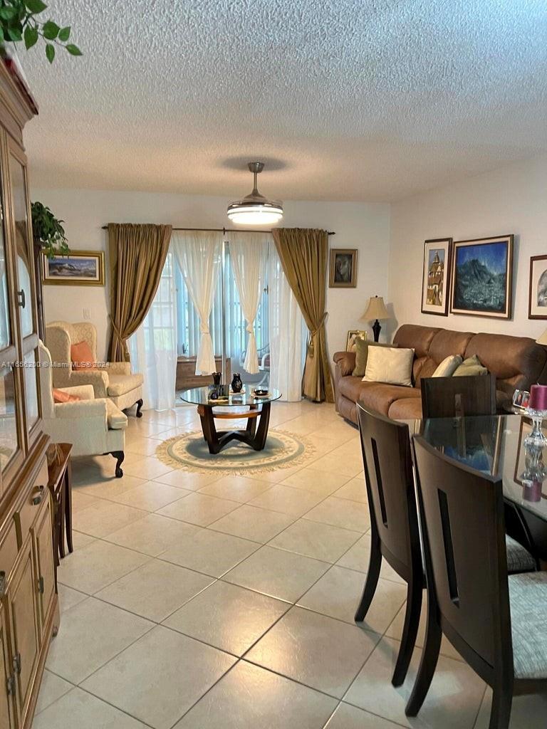 a view of a livingroom with furniture and a window