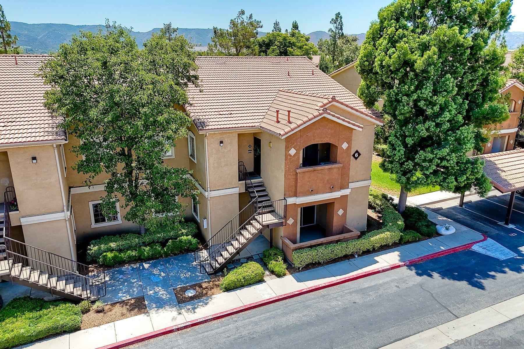 an aerial view of a house with yard