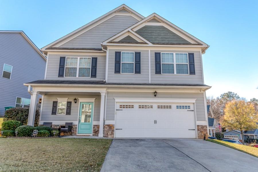 front view of a house with a yard