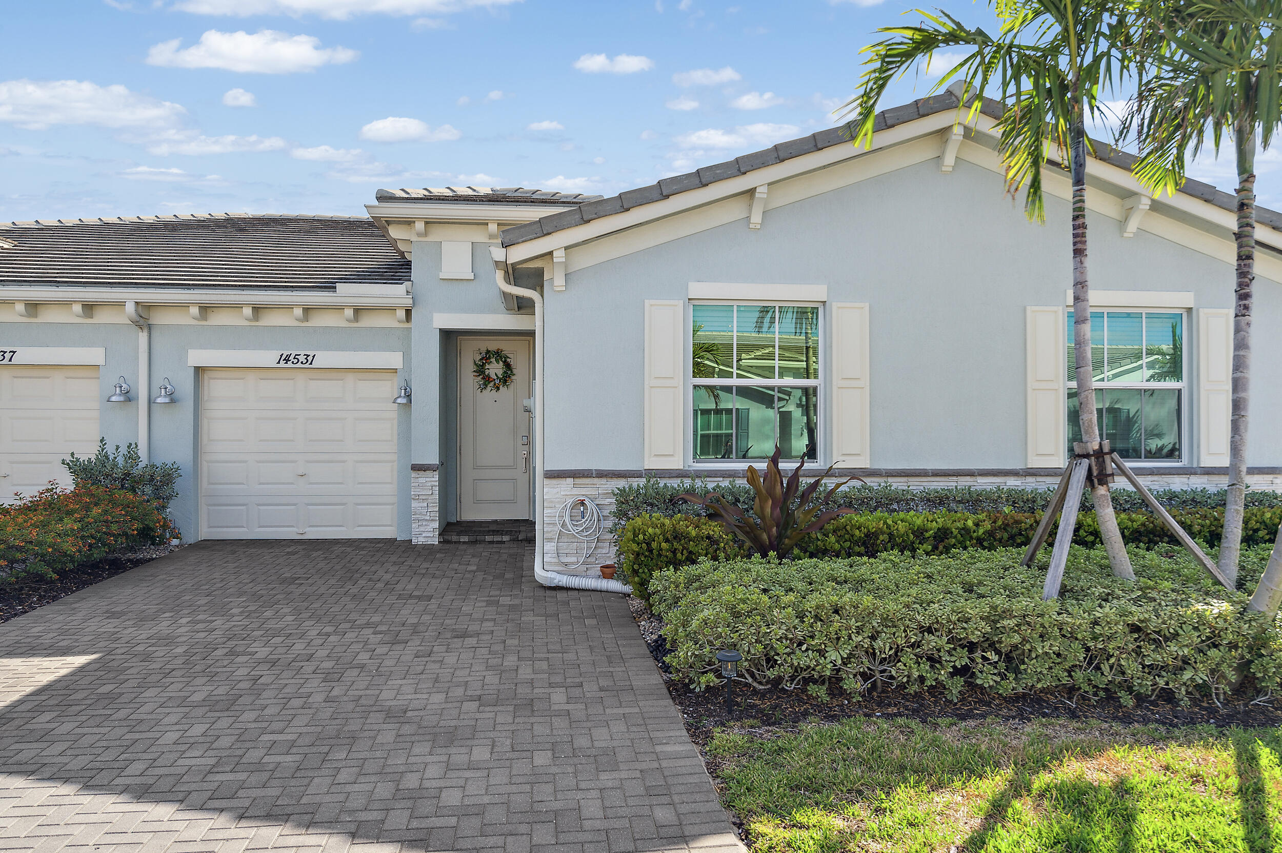 a front view of a house with a yard