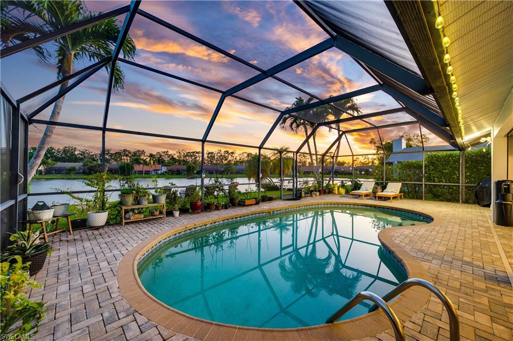 a view of a swimming pool with a sitting area