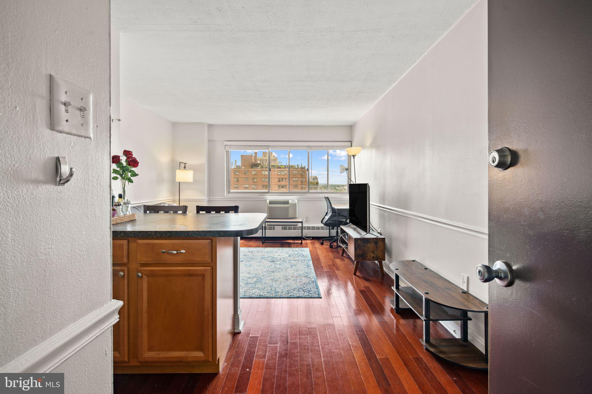 a kitchen with granite countertop a stove top oven sink and cabinets