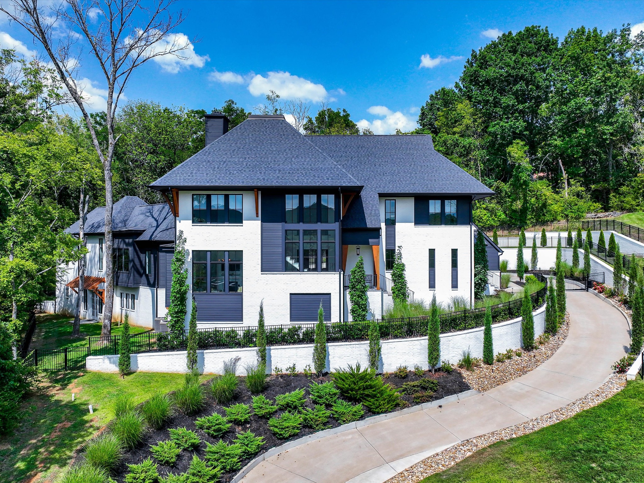 a front view of a house with a garden