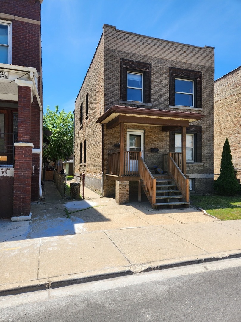 a view of a house with a street