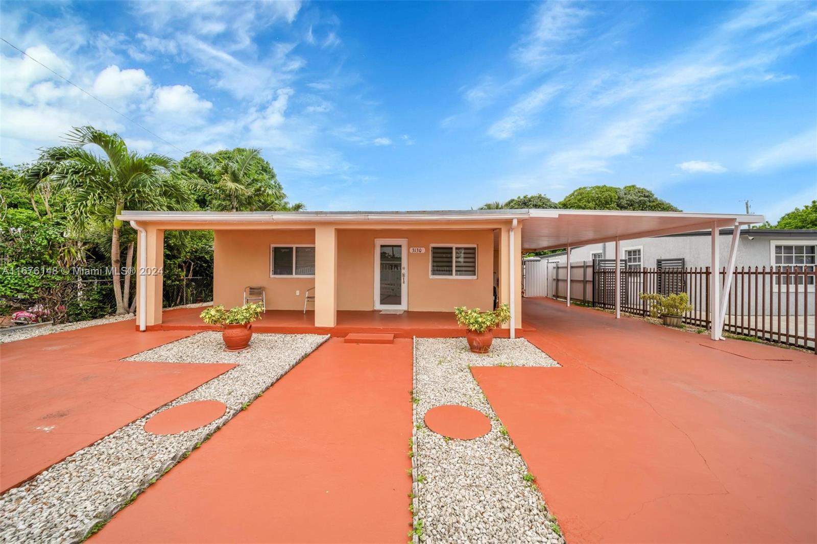 a front view of house with yard outdoor seating and barbeque oven