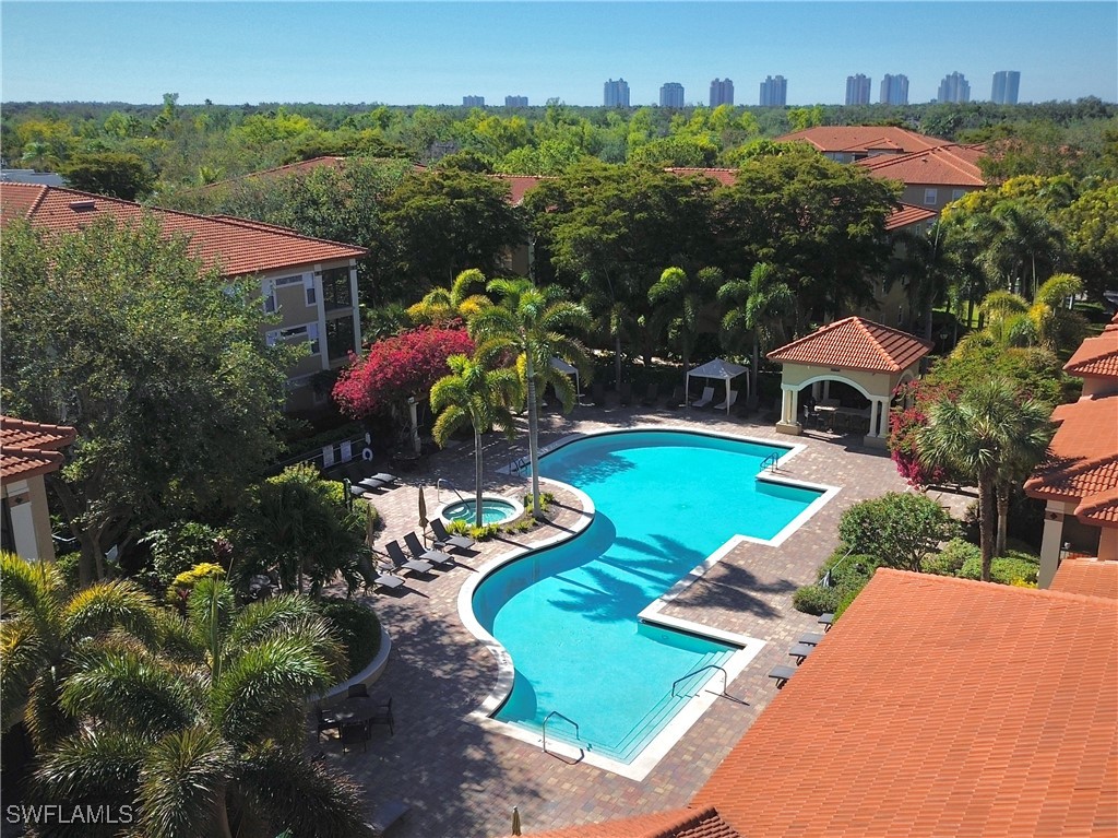 an aerial view of house with yard swimming pool and outdoor seating