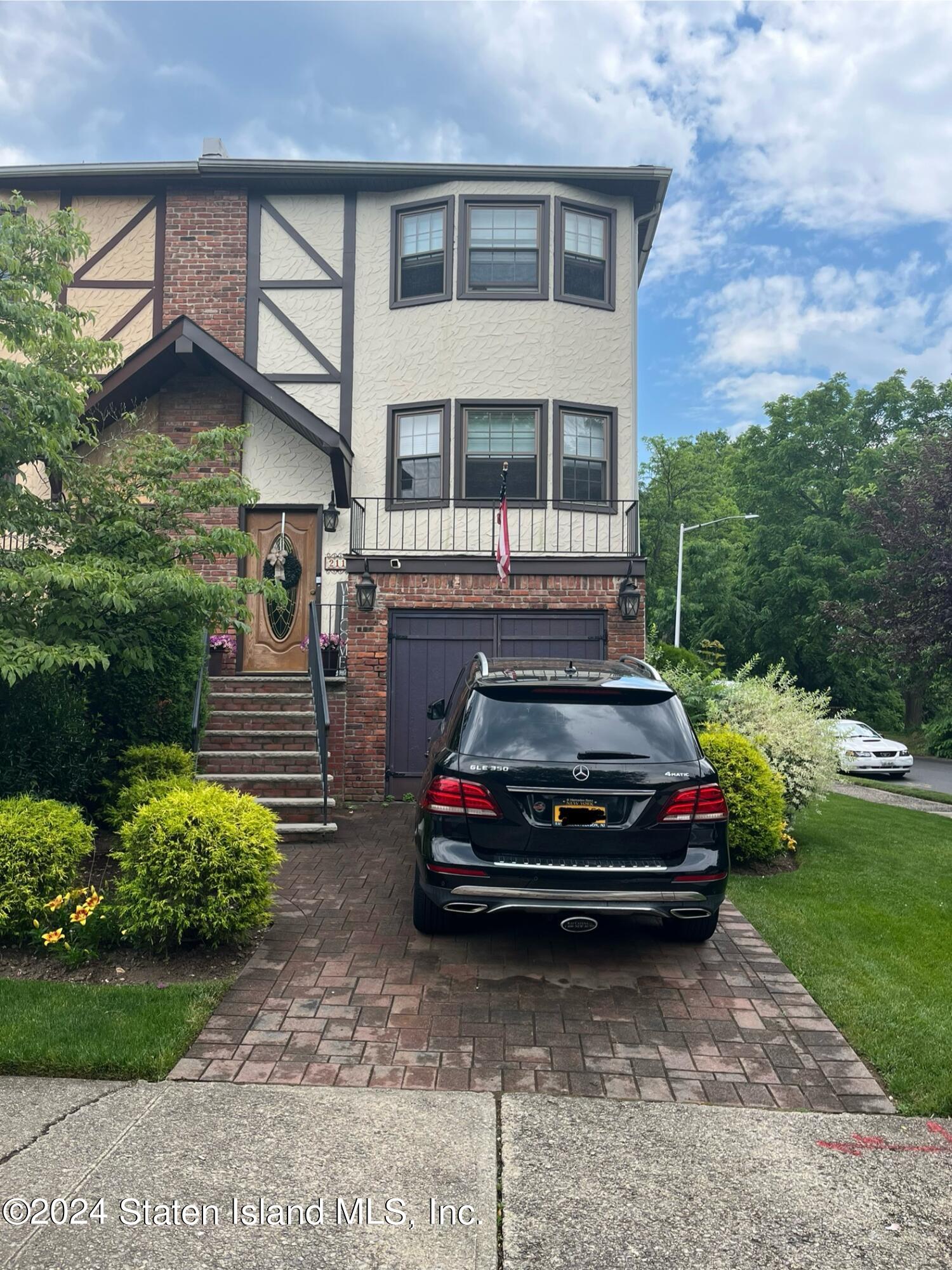 a car parked in front of a house