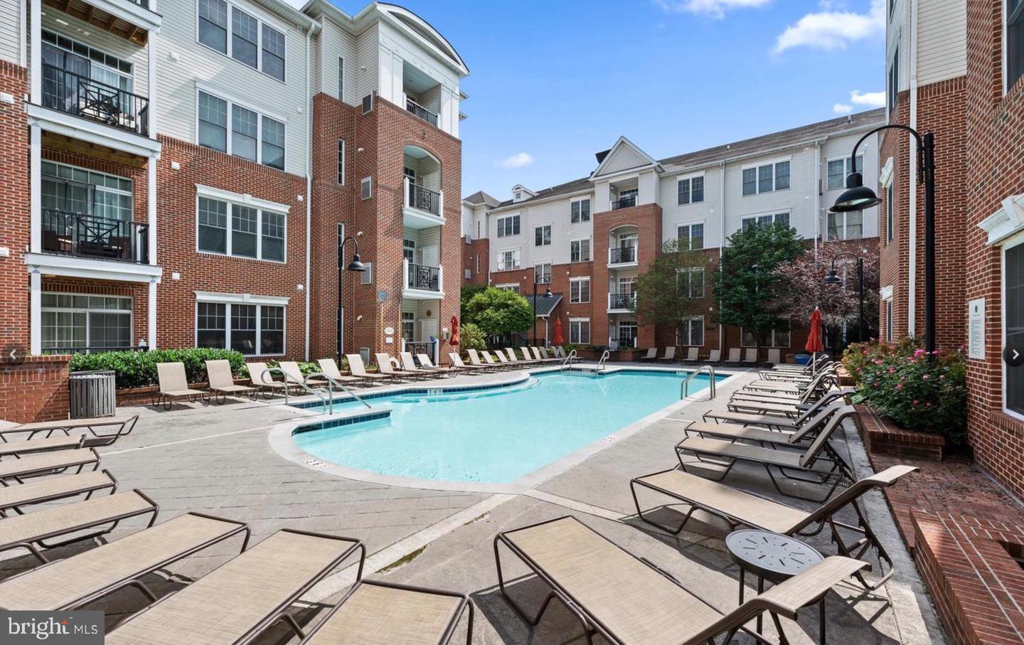 a view of a patio with swimming pool table and chairs