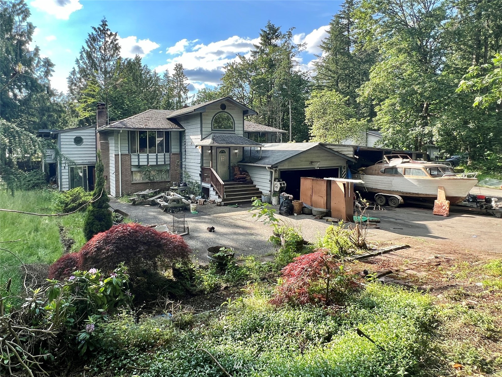 a front view of a house with garden