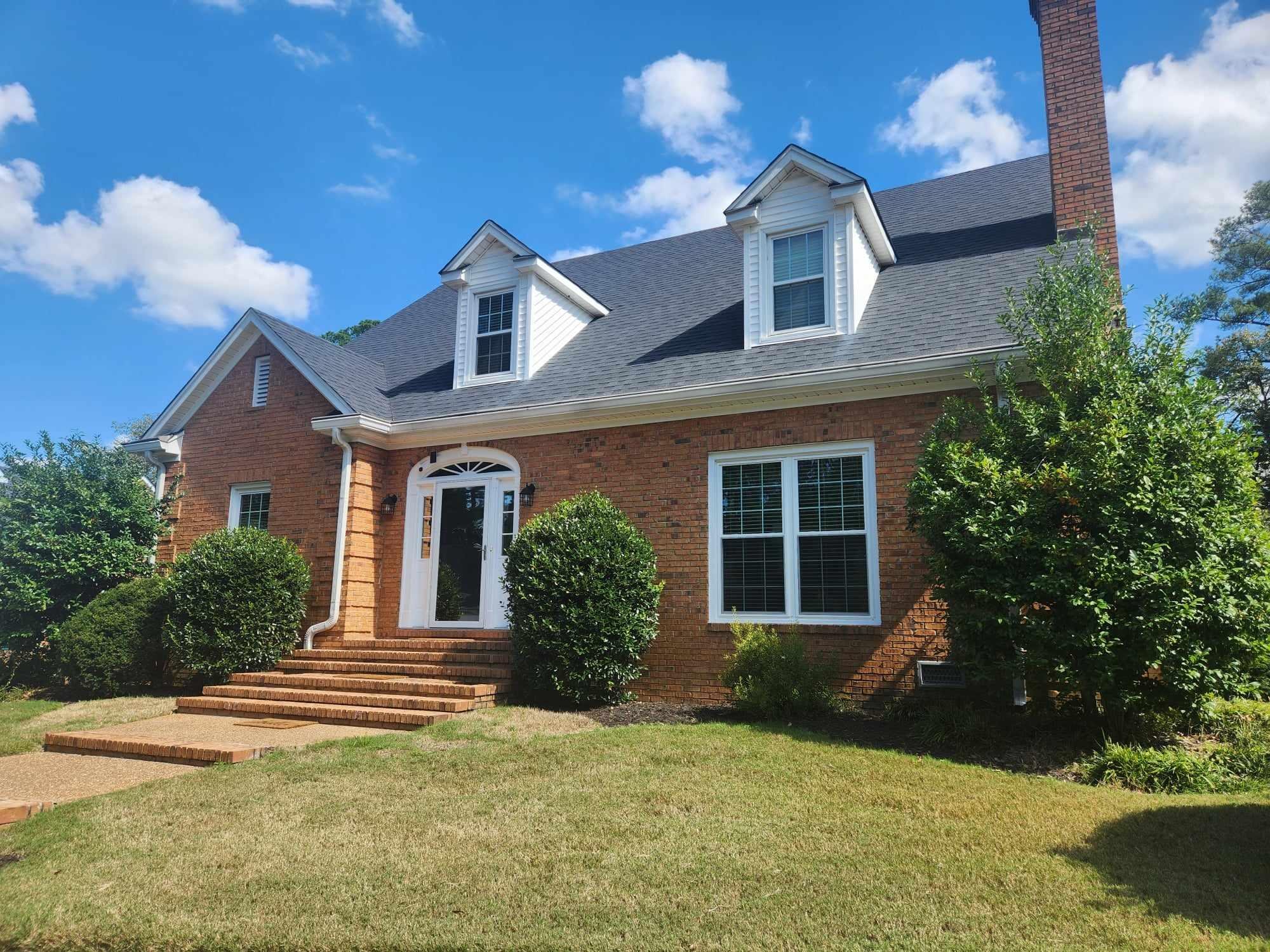 front view of a house with a yard