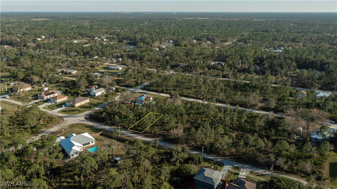 an aerial view of a town with trees