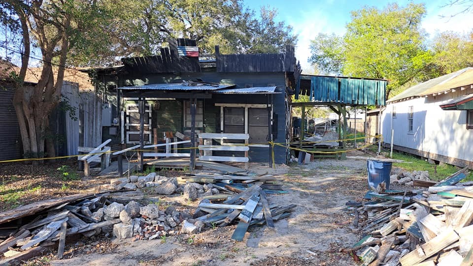 a view of a chairs and table in backyard