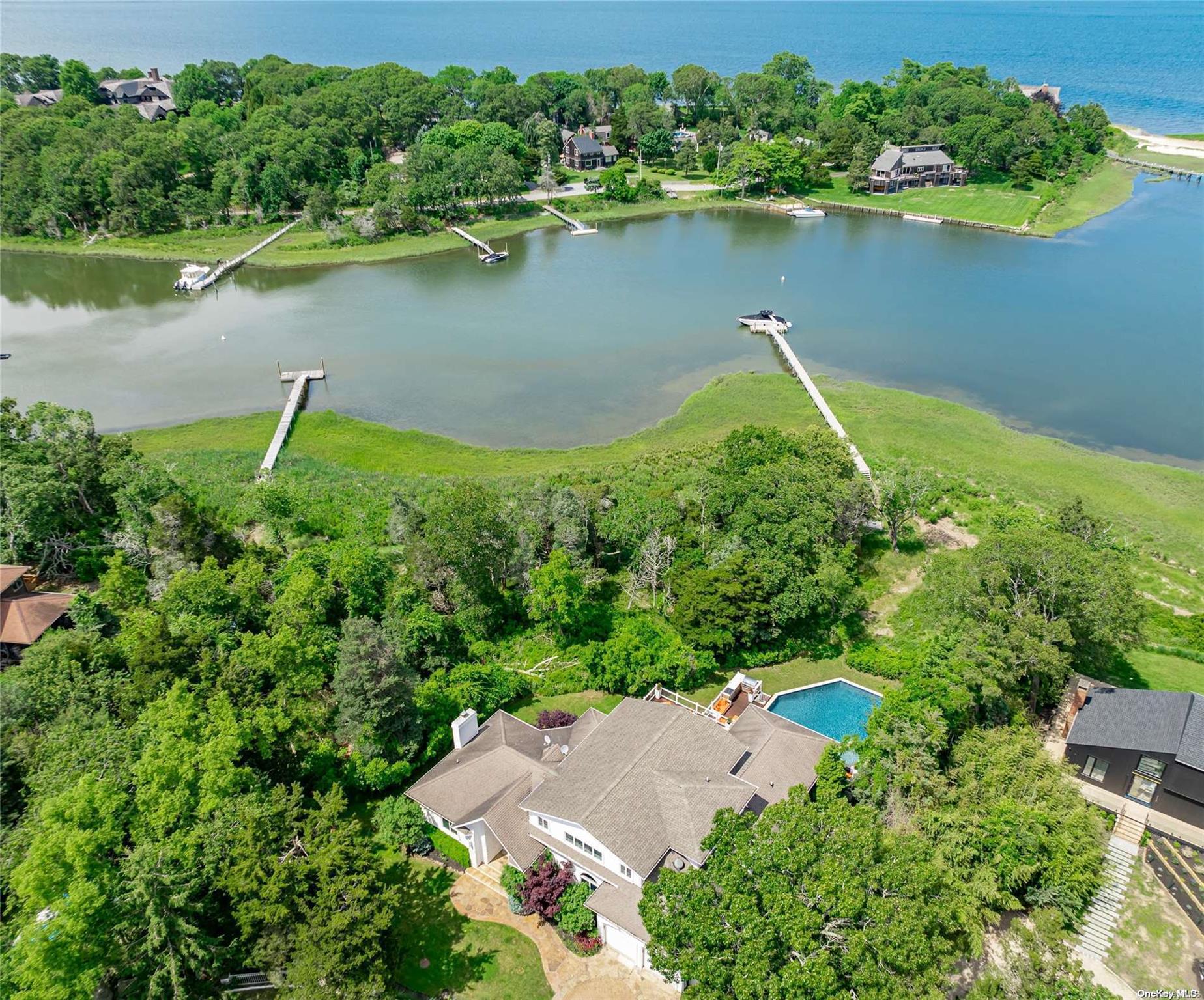 an aerial view of a houses with a lake view