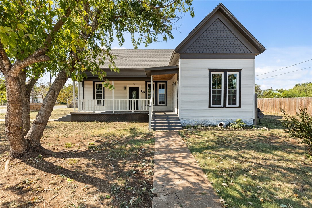 front view of a house with a yard