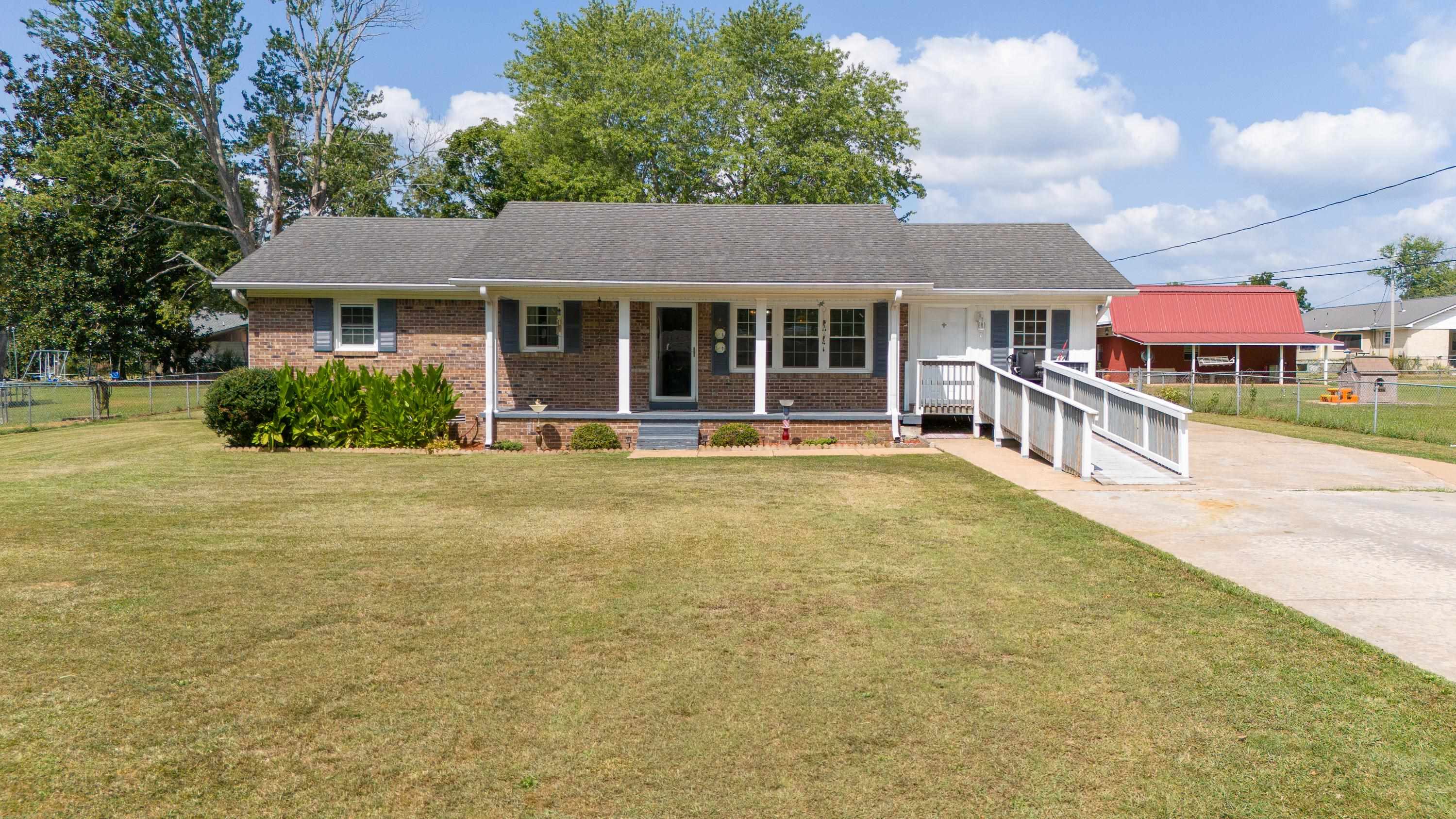 front view of a house with a yard