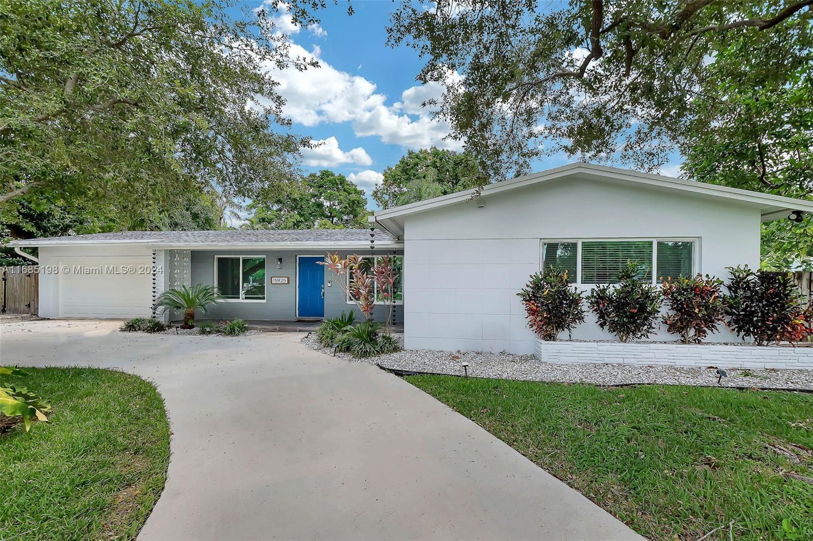 a front view of a house with a yard and porch