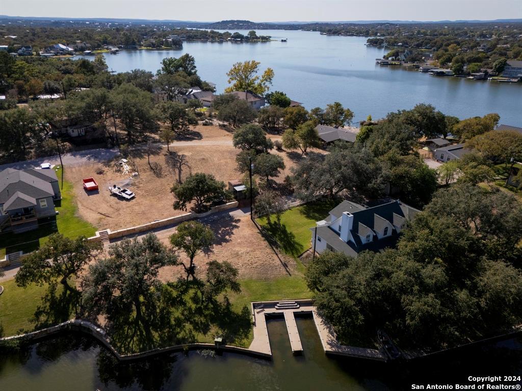 an aerial view of a house with a lake view