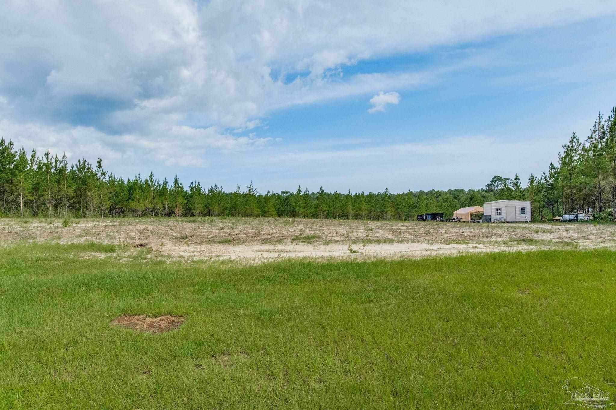 a view of a lake with a big yard