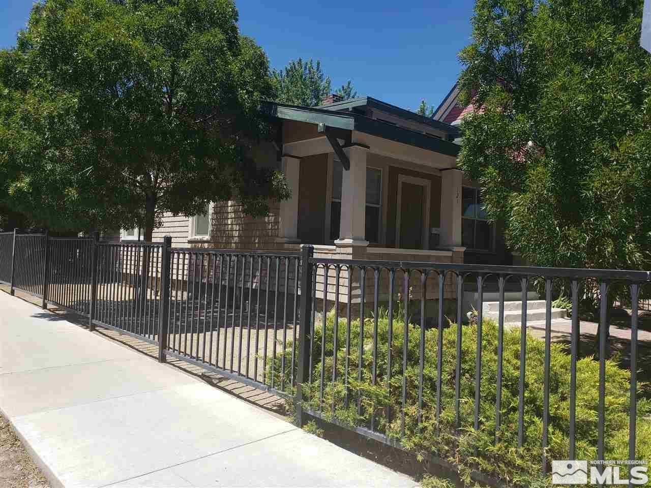 a view of a house with a small yard