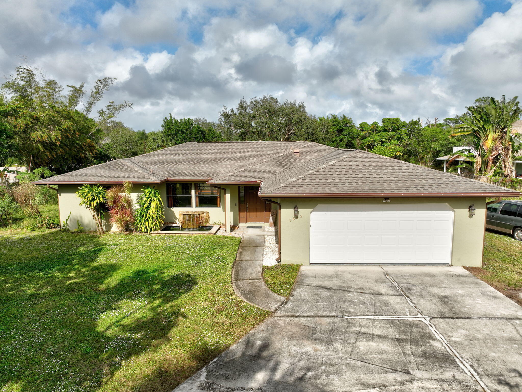 a front view of a house with garden