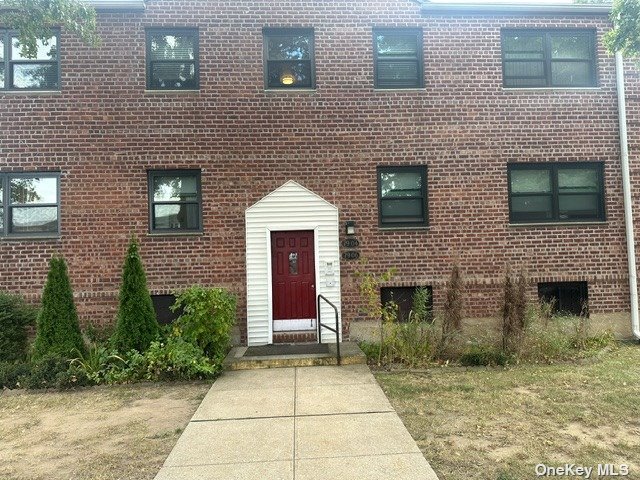 a front view of a house with yard