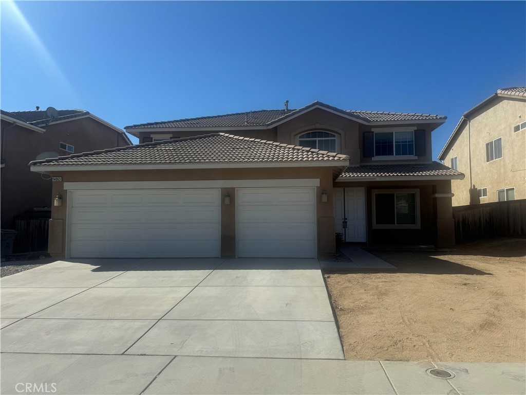 a front view of a house with a garage