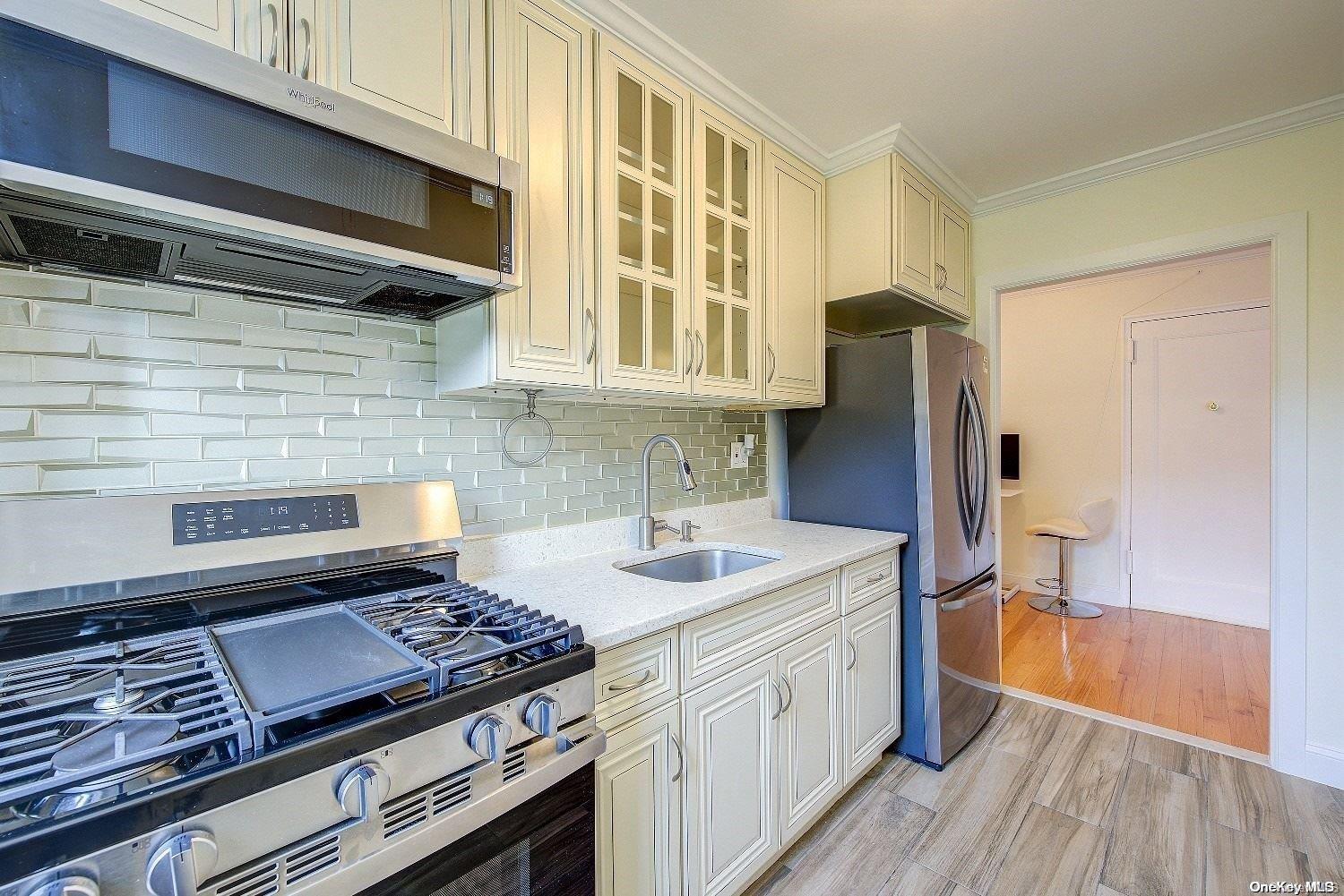 a kitchen with a stove and a refrigerator