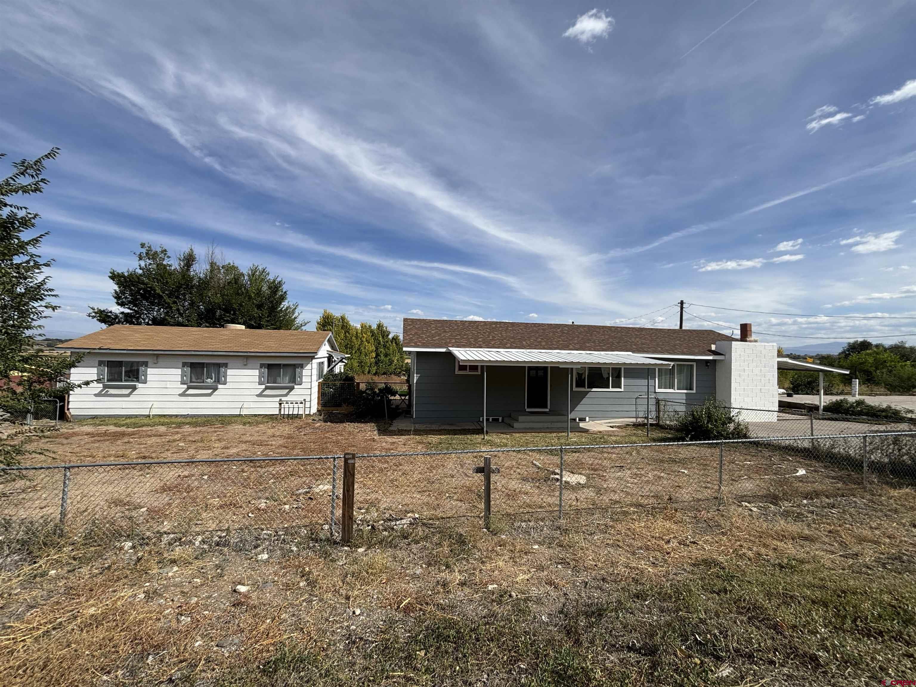 a front view of a house with yard