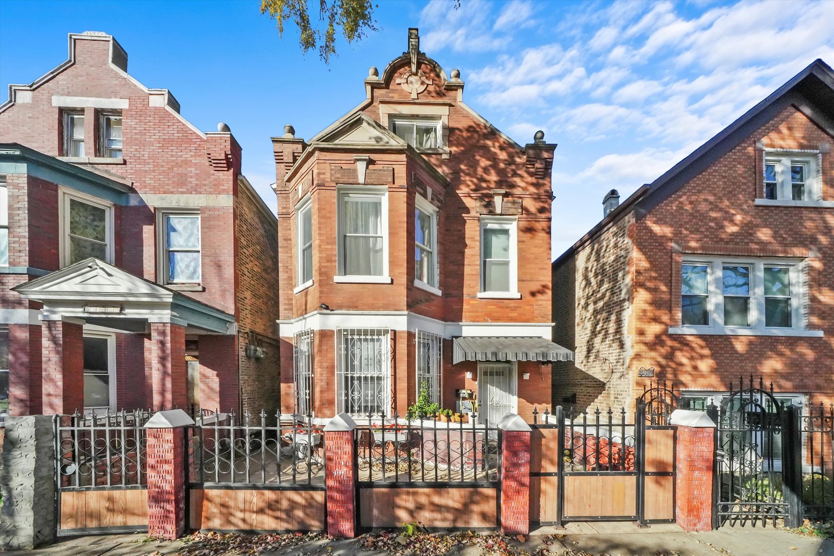 front view of a brick house with a street