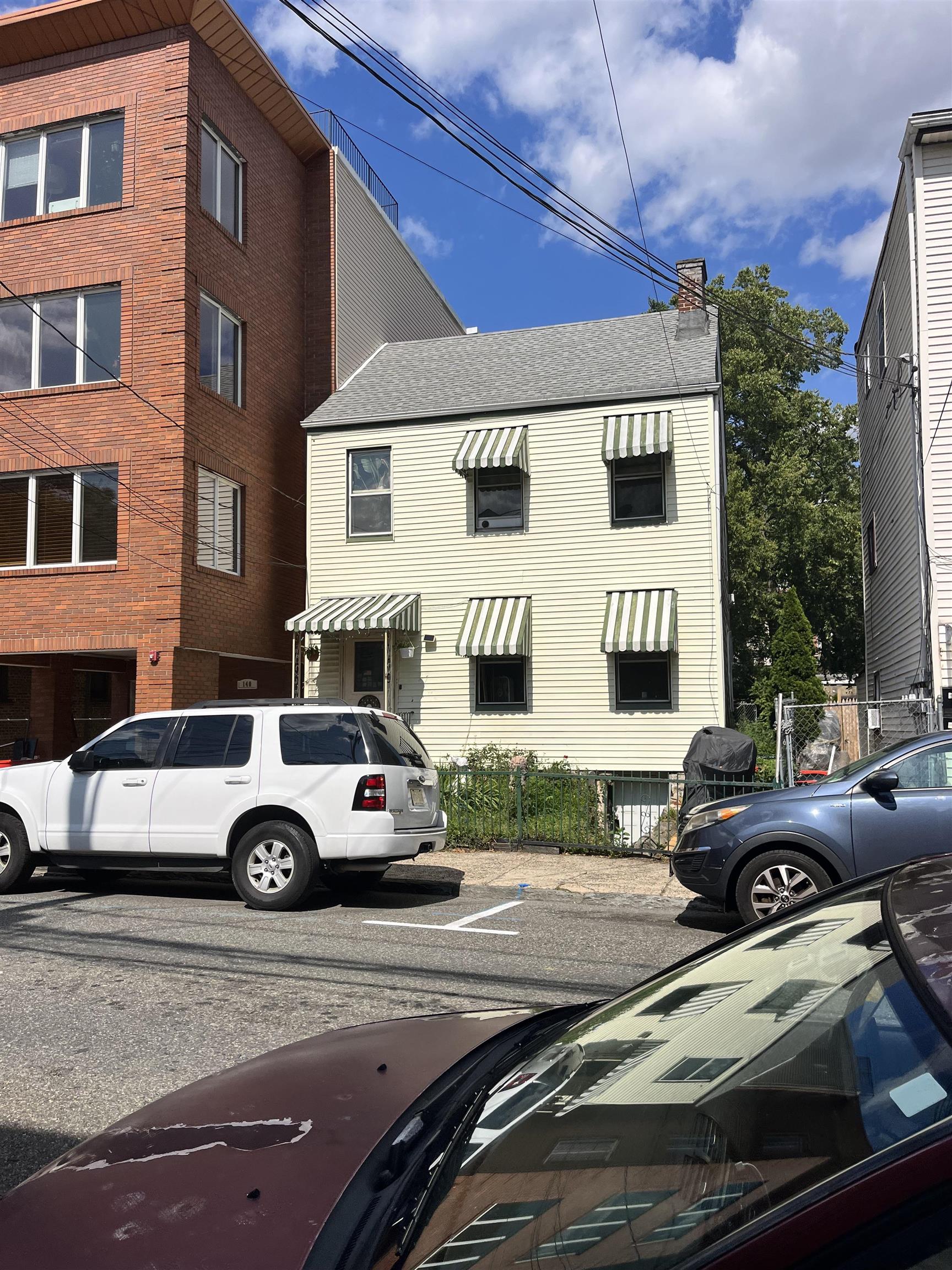 a car parked in front of a house