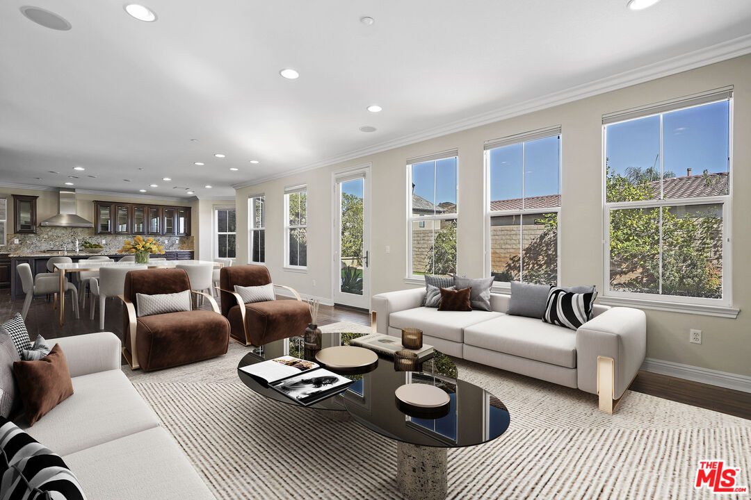 a living room with furniture and a table