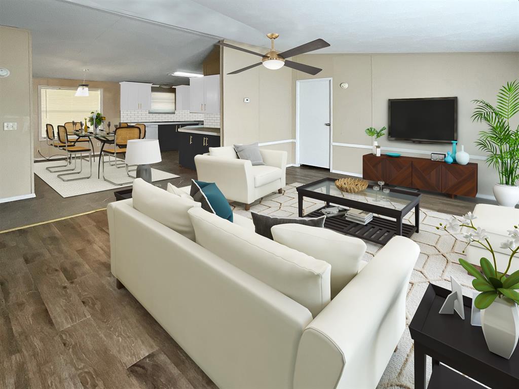 a living room with furniture and a flat screen tv