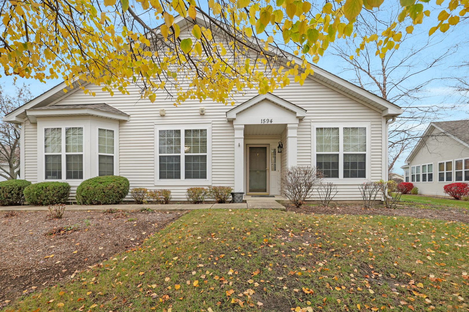 a front view of a house with yard