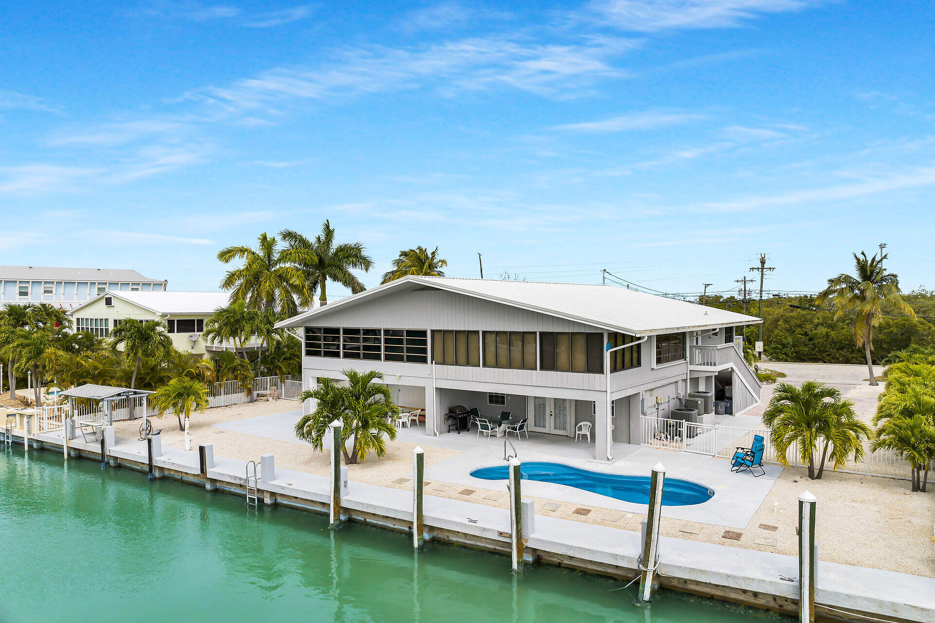 a house with swimming pool in front of it