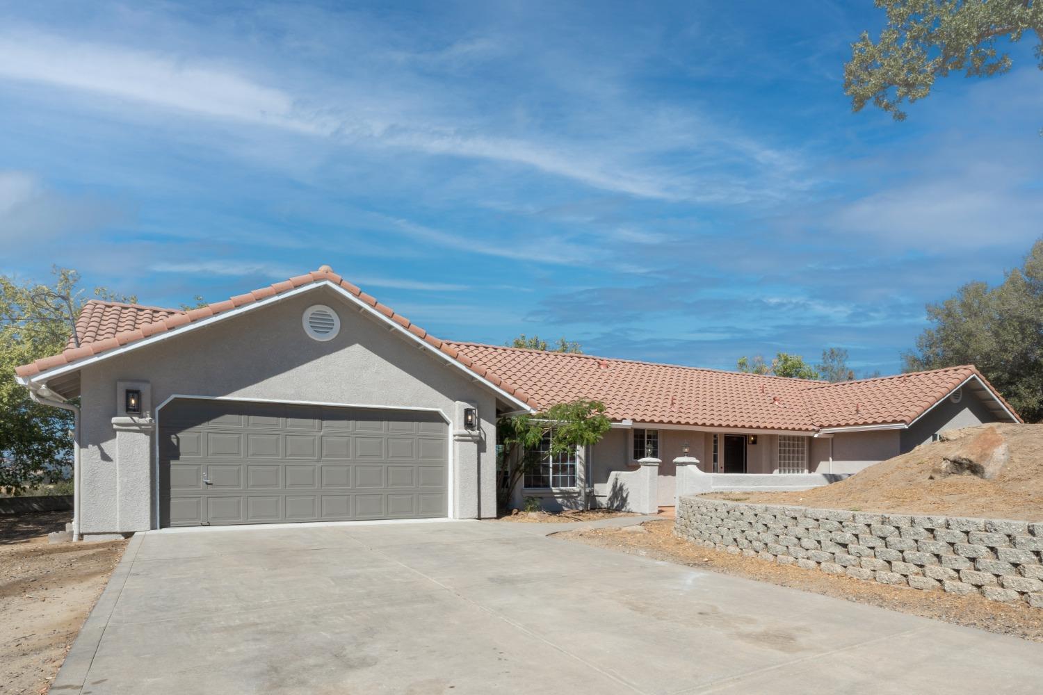 a front view of a house with a garage