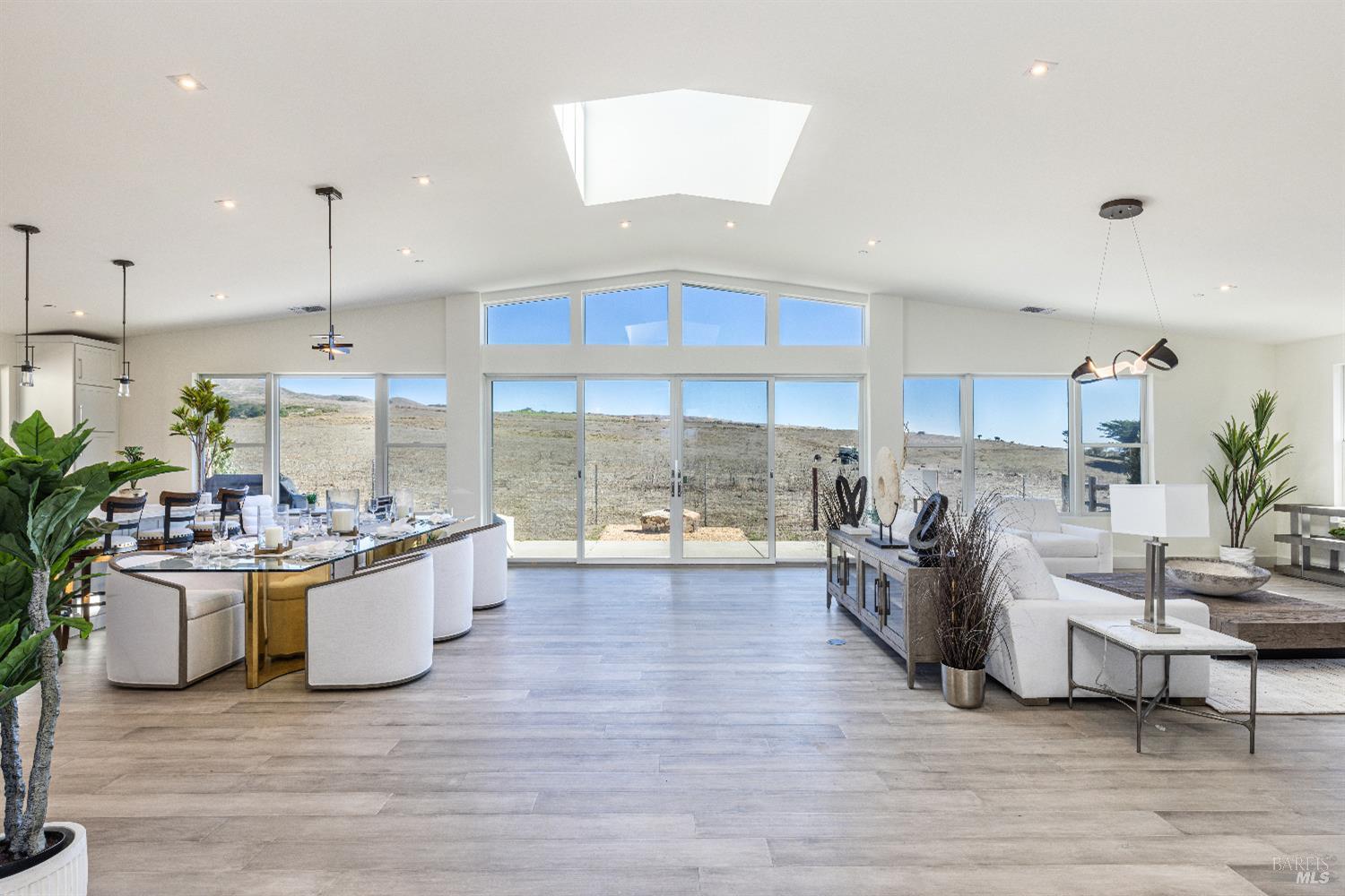 a kitchen with stainless steel appliances granite countertop a stove and a wooden floors