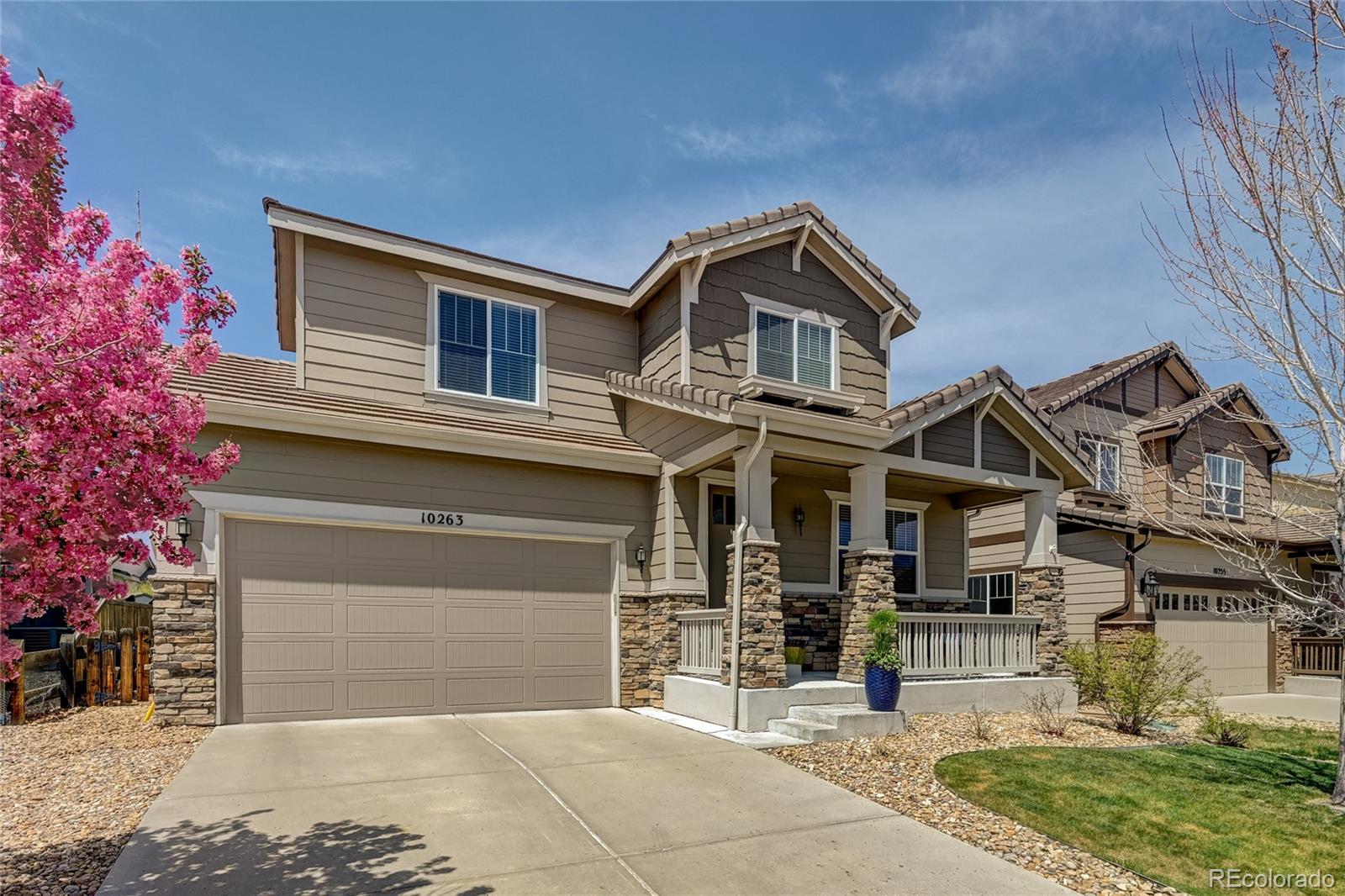 a front view of a house with a garage