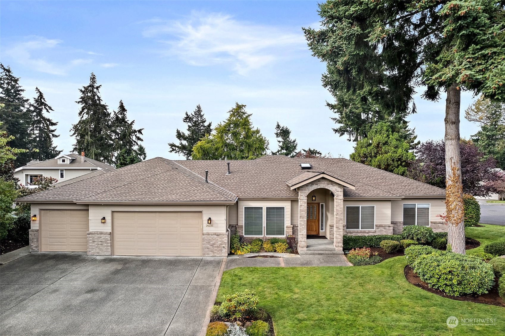 a front view of a house with garden