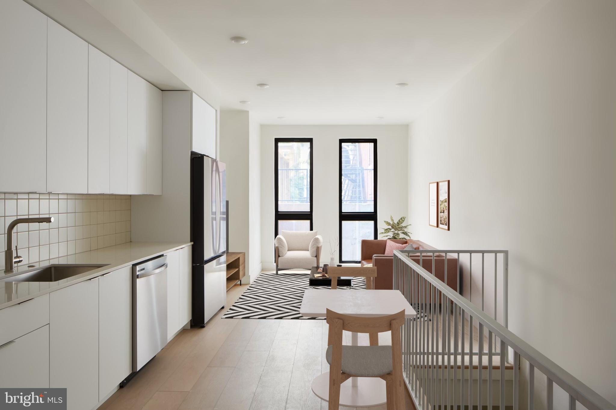 a kitchen with sink refrigerator and stove