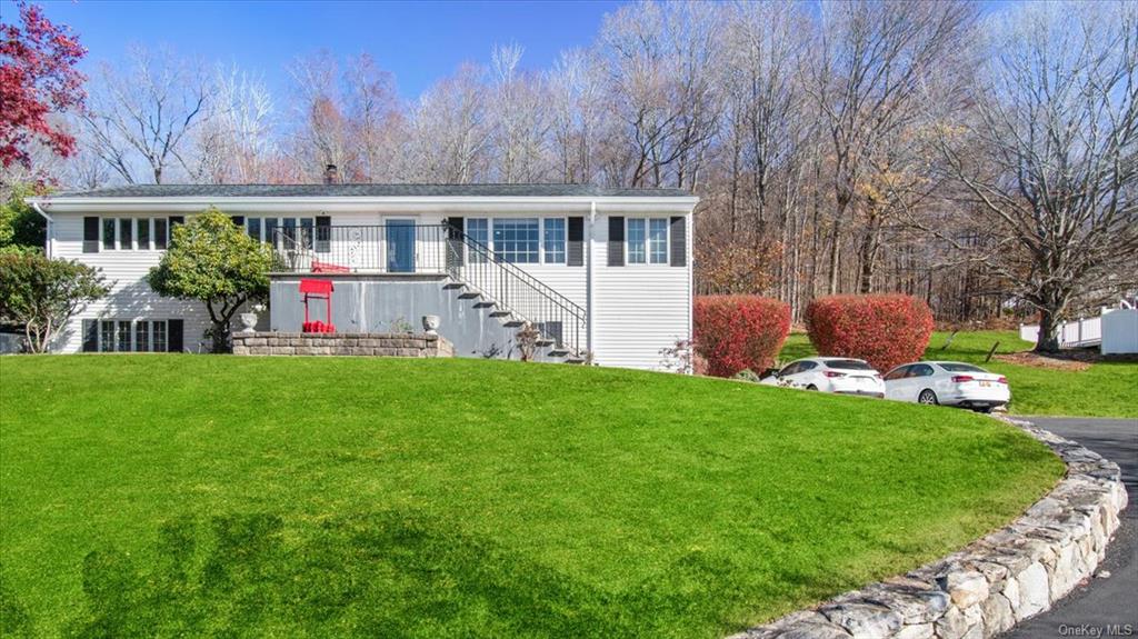 View of front of house with a front yard