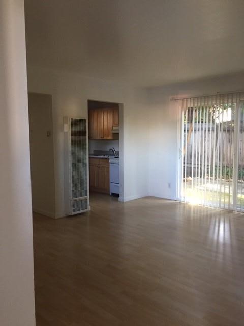 a view of empty room with floor to ceiling window