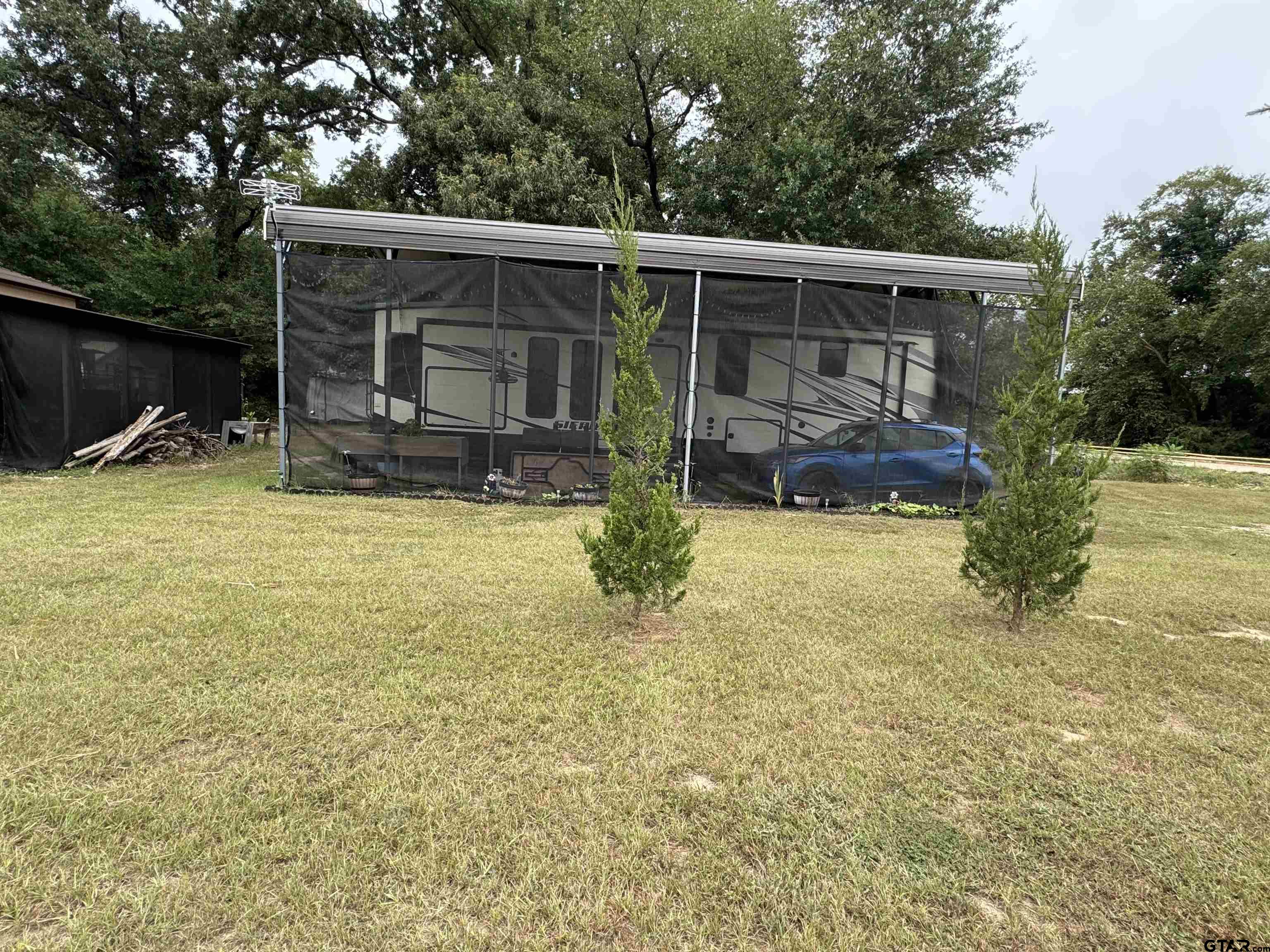 a view of a house with swimming pool and sitting area